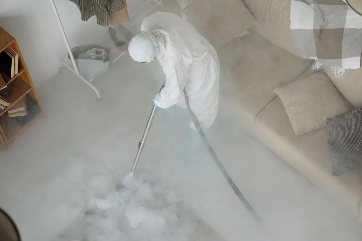 Biohazard cleanup technician in protective equipment, North Richland Hills, TX